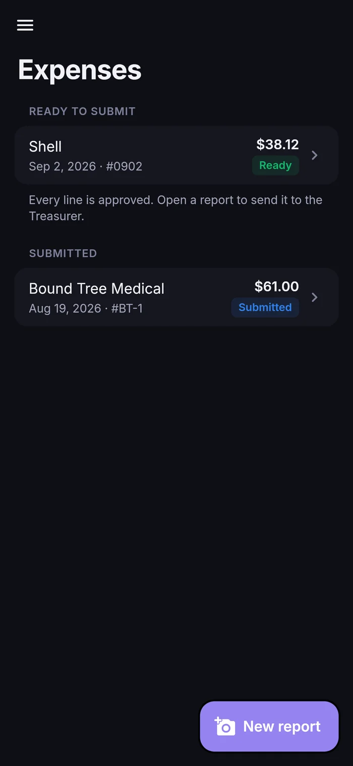 Expenses list in dark mode with a report ready to submit and one already submitted